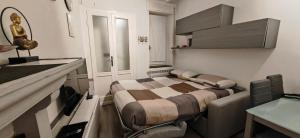 a small room with a bed and a sink in it at Casa Fiocchi b&b in Lacchiarella