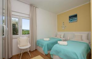 Łóżko lub łóżka w pokoju w obiekcie Four-Bedroom Holiday Home In Grubine