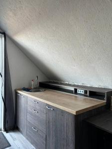 a kitchen with a sink and a roof at Elen in Goliševa