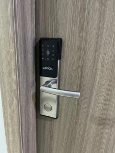 a door opener with a remote control in it at Aras Solace Place in Trece Martires