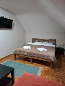 Postel nebo postele na pokoji v ubytování Hotel Koliba na Grza