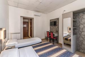Postel nebo postele na pokoji v ubytování Hotel principe