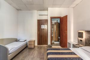 Postel nebo postele na pokoji v ubytování Hotel principe