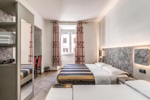 Postel nebo postele na pokoji v ubytování Hotel principe