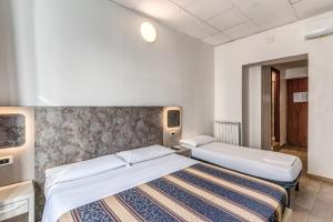 Postel nebo postele na pokoji v ubytování Hotel principe