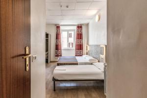 Postel nebo postele na pokoji v ubytování Hotel principe