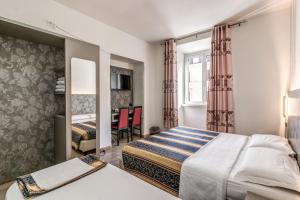 Postel nebo postele na pokoji v ubytování Hotel principe