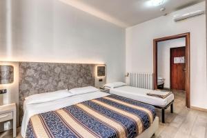 Postel nebo postele na pokoji v ubytování Hotel principe