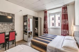 Postel nebo postele na pokoji v ubytování Hotel principe