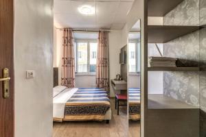 Postel nebo postele na pokoji v ubytování Hotel principe