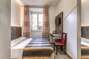 Postel nebo postele na pokoji v ubytování Hotel principe