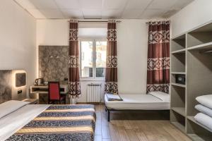 Postel nebo postele na pokoji v ubytování Hotel principe