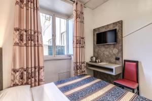 Postel nebo postele na pokoji v ubytování Hotel principe