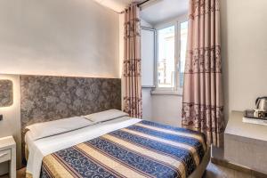 Postel nebo postele na pokoji v ubytování Hotel principe