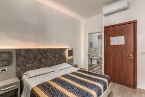 Postel nebo postele na pokoji v ubytování Hotel principe