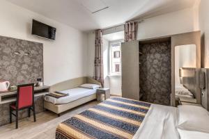 Postel nebo postele na pokoji v ubytování Hotel principe