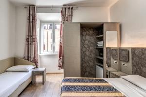 Postel nebo postele na pokoji v ubytování Hotel principe