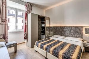 Postel nebo postele na pokoji v ubytování Hotel principe