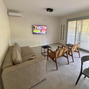 a living room with a cat laying on a couch at Rincon de Lobos in La Estafeta +7 photos