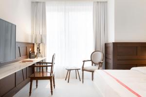 Postel nebo postele na pokoji v ubytování Ruby Rosi Hotel Munich
