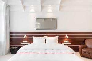Postel nebo postele na pokoji v ubytování Ruby Lotti Hotel Hamburg