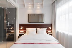 Postel nebo postele na pokoji v ubytování Ruby Lotti Hotel Hamburg