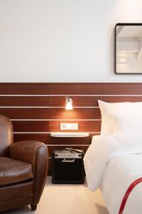 Postel nebo postele na pokoji v ubytování Ruby Lotti Hotel Hamburg