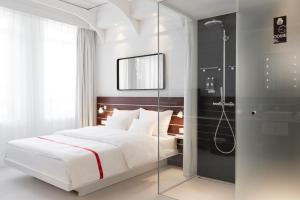 Postel nebo postele na pokoji v ubytování Ruby Lotti Hotel Hamburg
