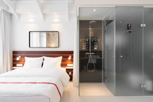 Postel nebo postele na pokoji v ubytování Ruby Lotti Hotel Hamburg