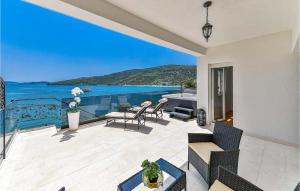 a house with a balcony with a view of the ocean at 3 Bedroom Nice Apartment In Marina in Marina +36 photos