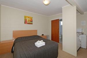 Cama o camas de una habitación en Trentham Motel