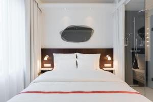 Voodi või voodid majutusasutuse Ruby Hanna Hotel Stuttgart toas