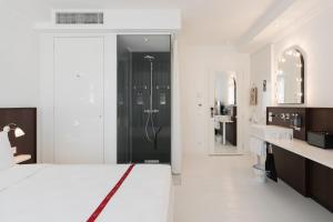 Llit o llits en una habitació de Ruby Bea Hotel Florence