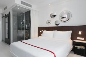 Llit o llits en una habitació de Ruby Bea Hotel Florence
