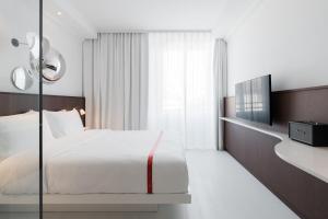 Llit o llits en una habitació de Ruby Bea Hotel Florence