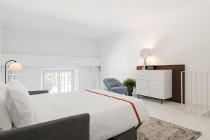 Llit o llits en una habitació de Ruby Bea Hotel Florence