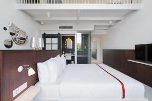 Postel nebo postele na pokoji v ubytování Ruby Bea Hotel Florence