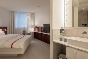 Postel nebo postele na pokoji v ubytování Ruby Marie Hotel Vienna