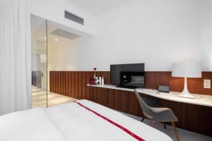 TV a/nebo společenská místnost v ubytování Ruby Marie Hotel Vienna