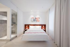 Postel nebo postele na pokoji v ubytování Ruby Marie Hotel Vienna