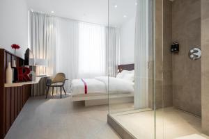 Postel nebo postele na pokoji v ubytování Ruby Marie Hotel Vienna