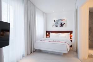 Postel nebo postele na pokoji v ubytování Ruby Marie Hotel Vienna