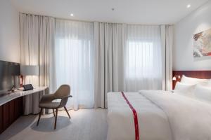 Postel nebo postele na pokoji v ubytování Ruby Marie Hotel Vienna