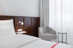 Ein Bett oder Betten in einem Zimmer der Unterkunft Ruby Mimi Hotel Zurich