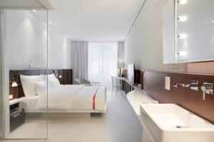 Ein Bett oder Betten in einem Zimmer der Unterkunft Ruby Mimi Hotel Zurich