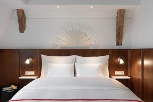 Ein Bett oder Betten in einem Zimmer der Unterkunft Ruby Mimi Hotel Zurich