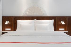 Ein Bett oder Betten in einem Zimmer der Unterkunft Ruby Mimi Hotel Zurich