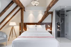 Ein Bett oder Betten in einem Zimmer der Unterkunft Ruby Mimi Hotel Zurich