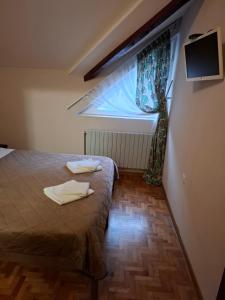Postel nebo postele na pokoji v ubytování Hotel Koliba na Grza