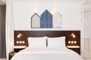 Voodi või voodid majutusasutuse Ruby Zoe Hotel London toas
